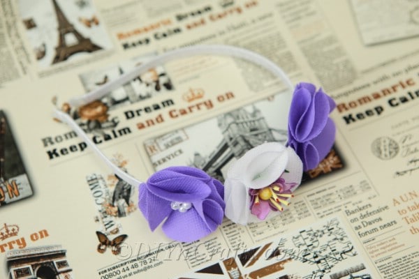 Flower headband laying on a newspaper