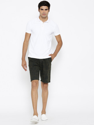 White Slip-on Sneakers Outfits For Men: Consider wearing a white polo and olive floral shorts to prove you