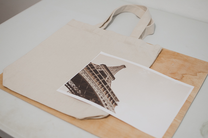 Photo of a canvas bag and a print of the Eiffel Tower