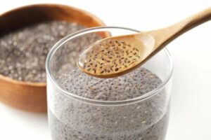 Photo of flax seed in water with wooden spoon from 