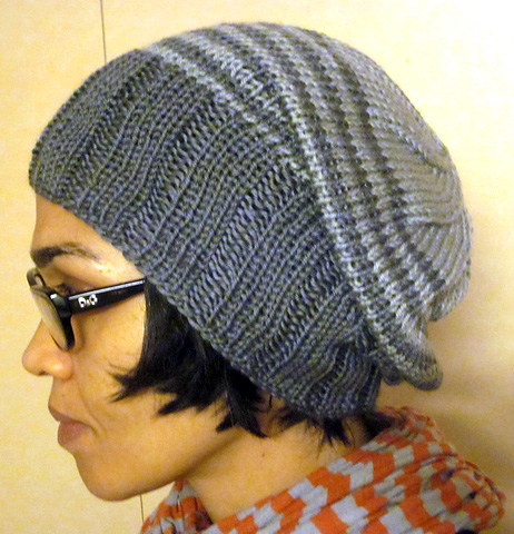 Free knitting pattern for Striped Light Stashbuster Slouch Hat - Karen Wrai Karn’s slouchy hat features a wide ribbed brim that can be folded up and is designed to use up stash and oddball yarn.
