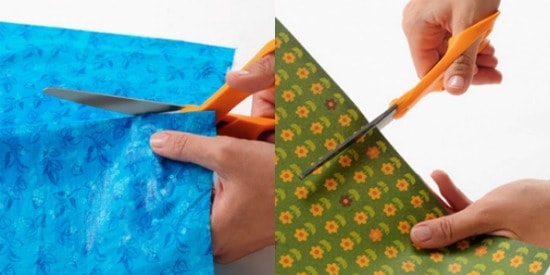 Cutting a piece of fabric or paper with scissors