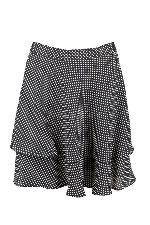 Black flared knee length skirt with dots. Isolated over white royalty free stock photography