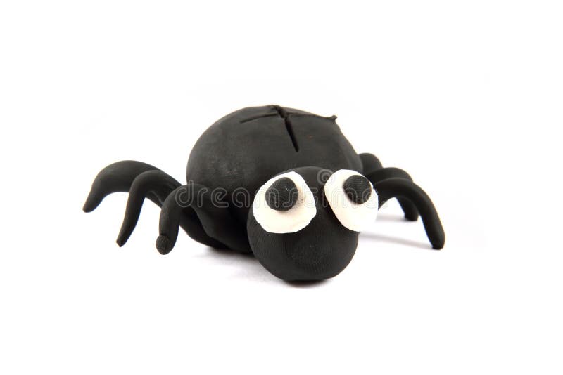 Black spider from the plasticine. Isolated on the white background royalty free stock image