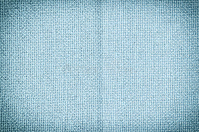 Blue fabric closeup. Blank background for layouts with fabric texture. Photo with vignette royalty free stock photography