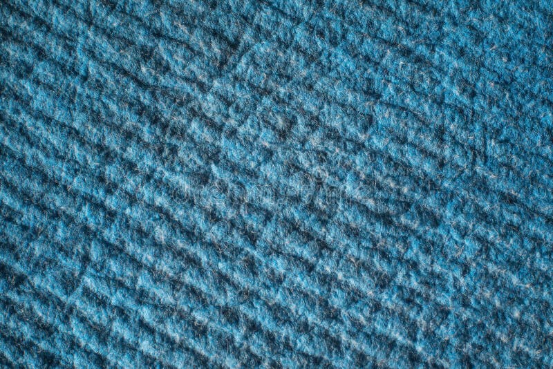 Blue textured tissue background. The pattern on the fabric surface. Pile on a dense and warm material stock image