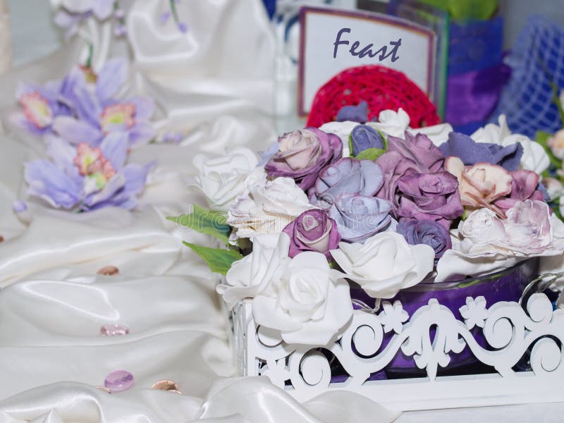 Cake decorated with flowers from a pastry mastic stands royalty free stock photos