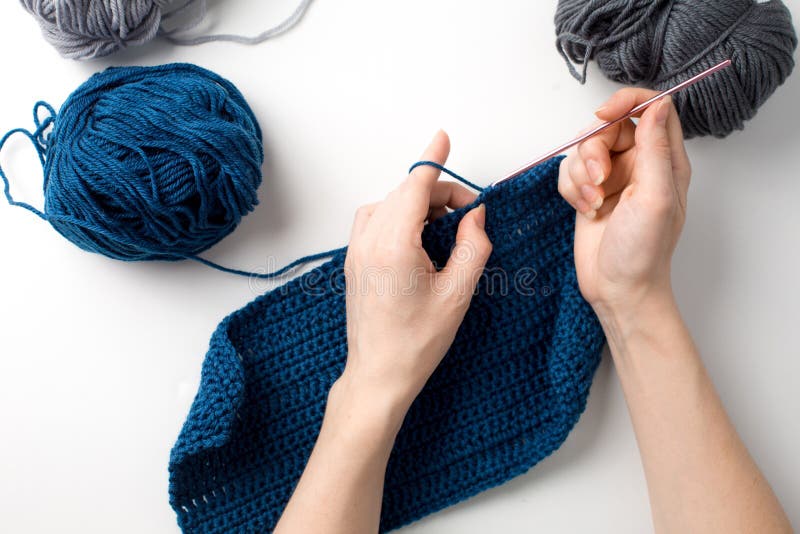 Character Woman Knitting Scarf with Blue Thread royalty free stock image