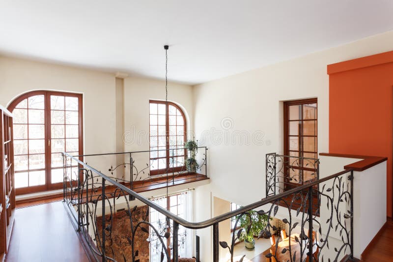 Classy house - Mezzanine. With an elegant metal banister royalty free stock photo