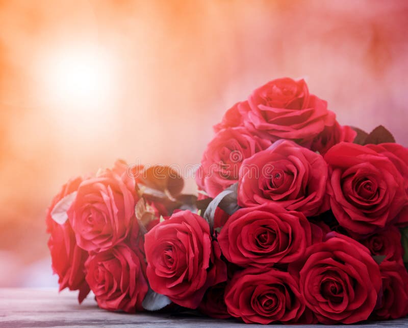 close up beautiful red roses bouguet with glowing light background for valentine day and love theme royalty free stock image