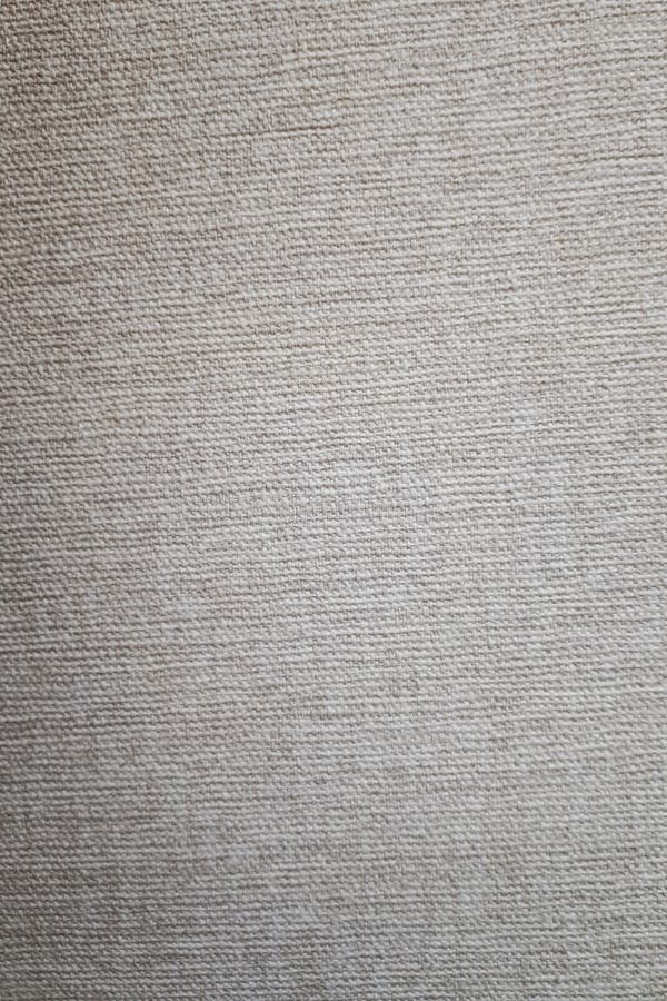 Closeup dense linen for curtains, beige, gray color. Vertical photo stock photography