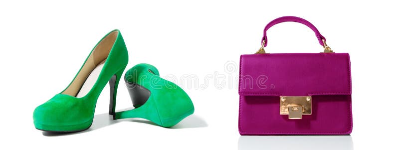 Closeup of fashionable high heels shoes and woman bag isolated on white background. Green color shoe and pink handbag on floor. Shopping and fashion concept royalty free stock photography