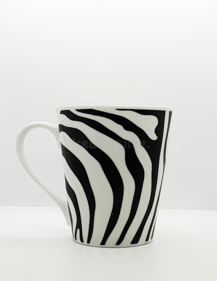 A coffee cup with zebra line pattern. Zebra patters stock photos