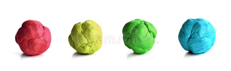 Colorful plasticine. Four colourful plasticine spheres of red, yellow, green and blue royalty free stock photo