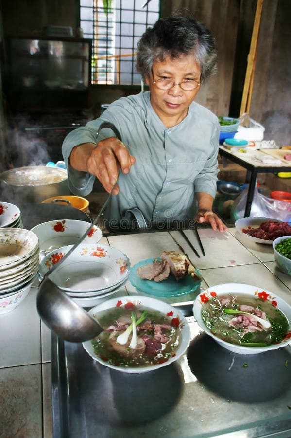 Cook at Pho restaurant stock photos