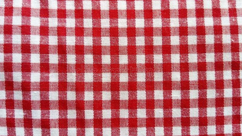 Cotton fabric for tablecloth. White-red small cell with perpendicular intersection of lines. Victoria, mademoiselle, vest, sweater, dining, room, oilcloth royalty free stock photo