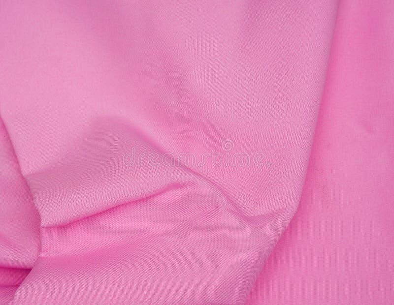 Creased pink gabardine. Rumpled texture.Folded fabric. Creased pink gabardine. Rumpled texture royalty free stock image