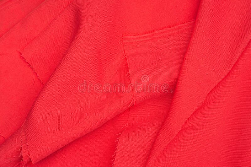 Creased red gabardine. Rumpled texture. Folded fabric. Creased red gabardine. Rumpled texture stock photo