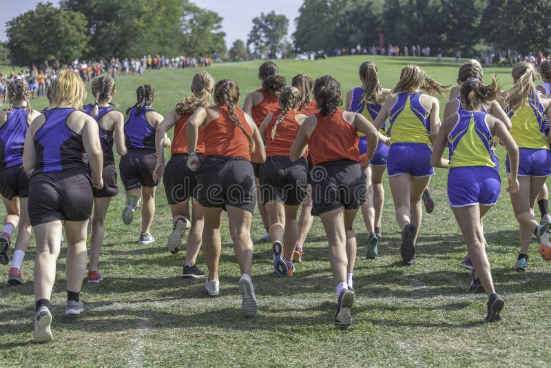 Cross Country Girls Race. Taking off at the starting line stock images