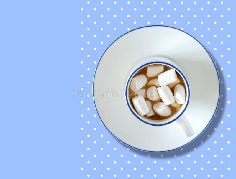 Cup of coffee with marshmallows on a background from a polka dot pattern. A good start to the day. Cup of coffee with marshmallows on a background from a polka royalty free stock photos