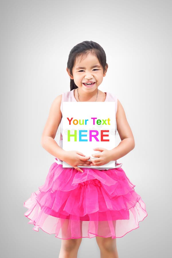 Cute little girl holding white board isolated on grey background stock images