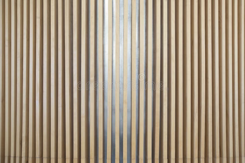 Decorative wall made with vertical wooden slats. stock photos