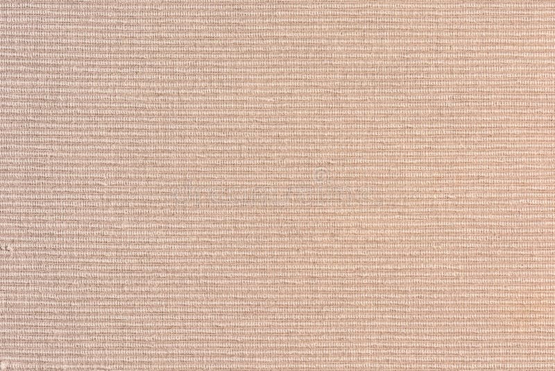 Dense beige upholstery fabric close up. Abstract blank background for layouts. Light photo royalty free stock photo