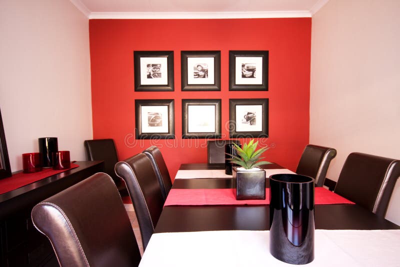 Dining room interior with red wall stock photography
