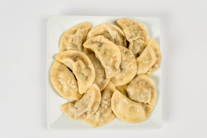 Dumplings on a white plate for cutting stock photo