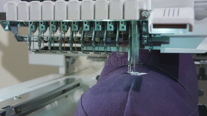 Embroidery Deals logo on the Cap. Embroidery machine deals logo on the cap dolly shoot stock photo