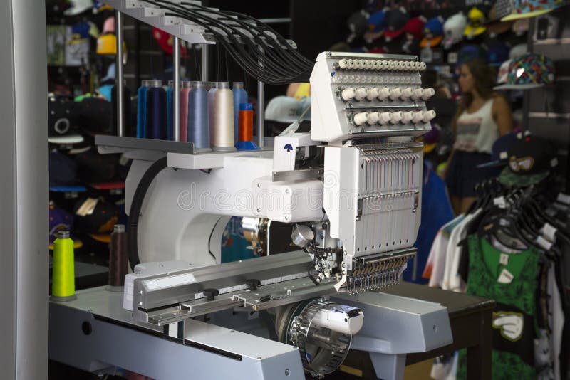 Embroidery machine. With spools of color threads stock image
