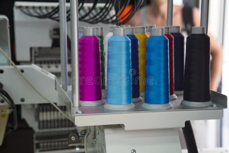 Embroidery machine. With spools of color threads royalty free stock image