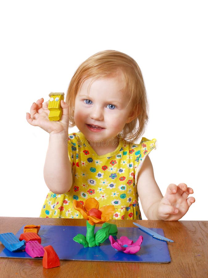 Girl with plasticine. Isolated on white stock photo