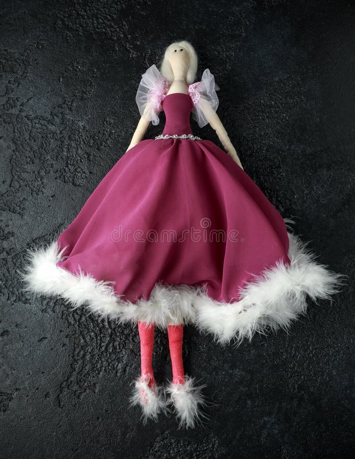 Handmade doll tilda in beautiful dress with white hair royalty free stock images