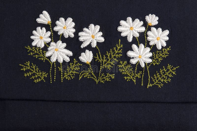 Handmade embroidery. Hobby work folkloric flowers royalty free stock image