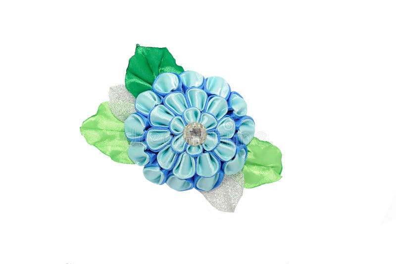 Kanzashi.Beautiful blue artificial flower with brocade, isolated. On white stock photography