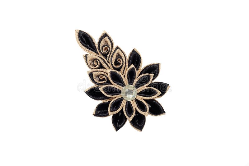Kanzashi.Beautiful golden black artificial flower with brocade,. Isolated on white royalty free stock photo