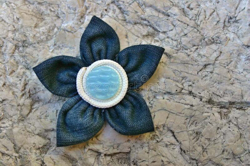 Kanzashi fabric flower. Kanzashi are hair ornaments used in traditional Japanese hairstyles. The term kanzashi is sometimes applied to the folded cloth flowers stock images