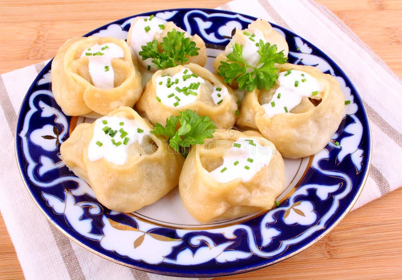 Manti, dumplings with minced meat and cream. Horizontal stock image