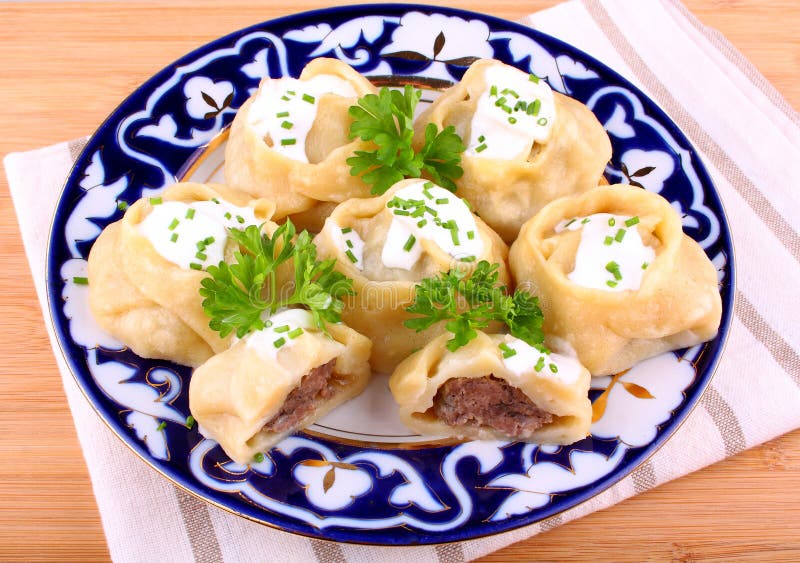 Manti, dumplings with minced meat and cream. Sliced stock image
