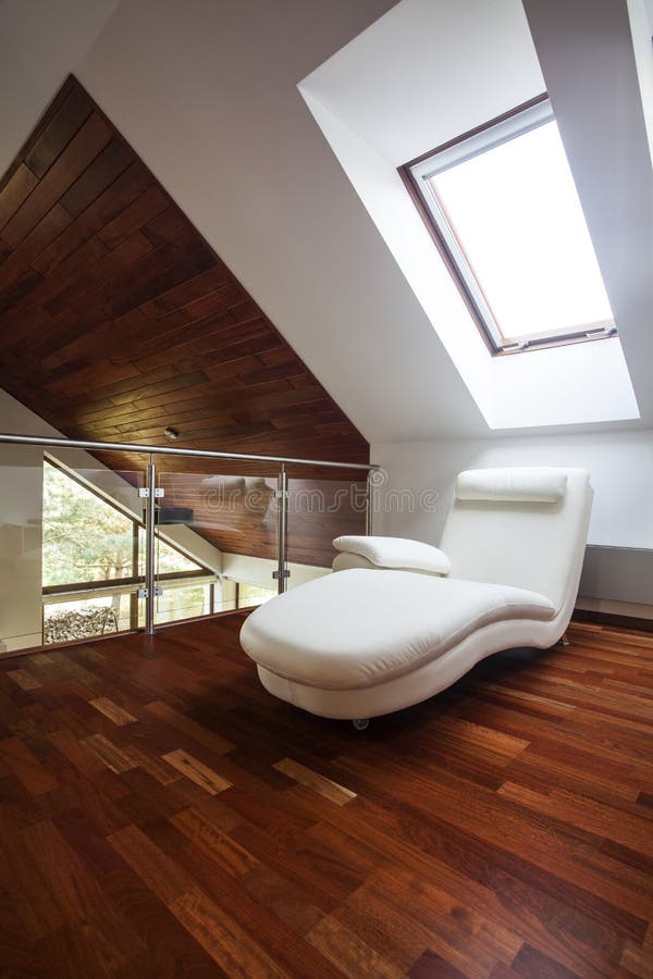 Mezzanine. Wooden attic with comfortable chair, stylish mezzanine royalty free stock photography