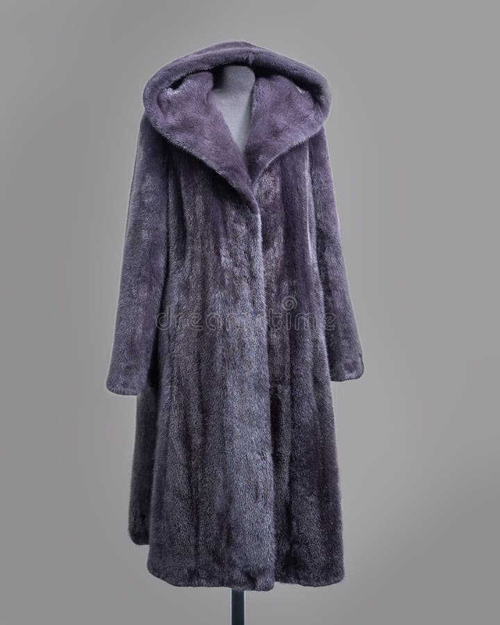 Mink coat gray-lilac color with hood and flared skirt Horizontal frame. For the store catalog stock photos