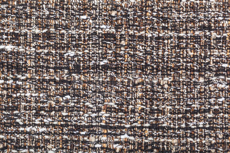 Motley woven yarns of boucle fabric close up. Textile background - motley woven yarns of boucle fabric close up stock image