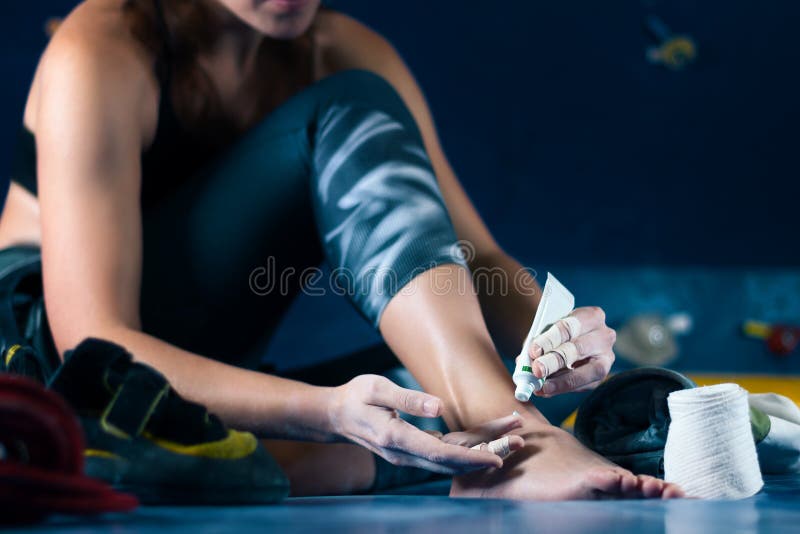 Muscle female woman climbing bouldering in training hall stock image