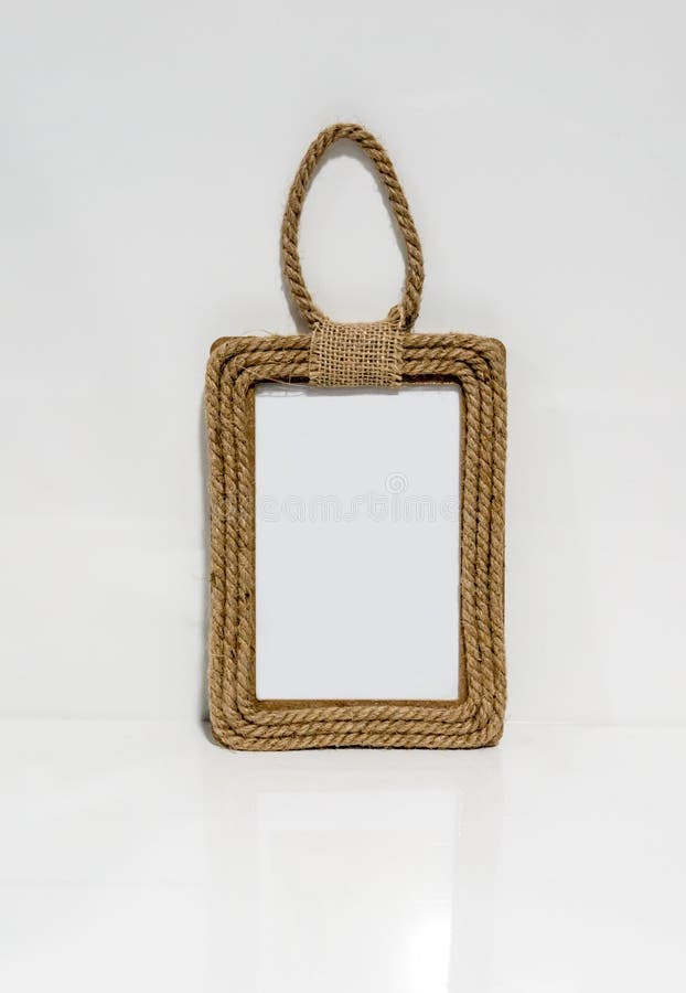 A photo frame made of hemp rope against white wall stock photos