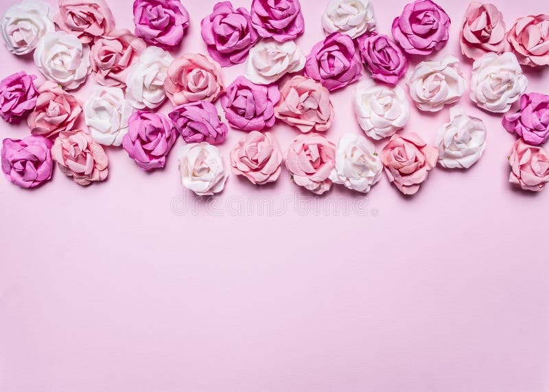 Pink background with colorful paper roses decorations Valentine