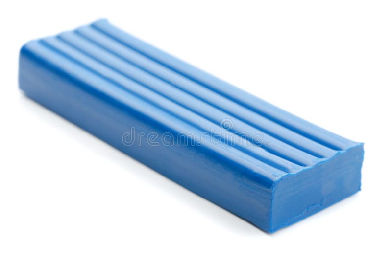 Plasticine. Blue bar of plasticine isolated on white stock image