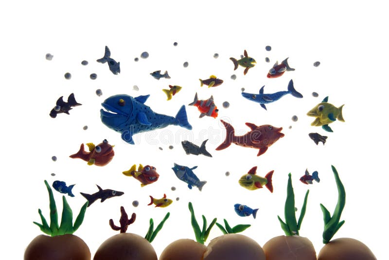 Plasticine fishes. Colorful shoal of plasticine tropical fish isolated over white royalty free illustration