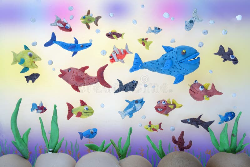 Plasticine marine life. Colorful shoal of plasticine tropical fish over a coral reef background stock illustration