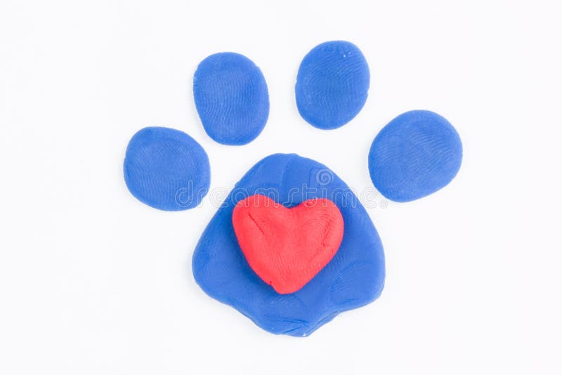 Plasticine paw and heart. Plasticine paw and heart - Stock Image macro stock images